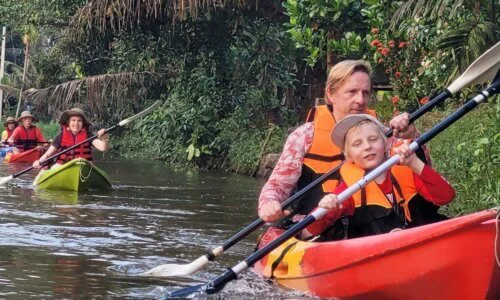 Kayaking in Kumarakom, Kerala, with the lush greenery and calm backwaters providing a serene and picturesque environment for outdoor adventure.