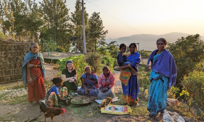 A traditional tribal village in Munnar, Kerala, featuring thatched huts surrounded by dense greenery, showcasing the cultural heritage and rural lifestyle of the indigenous communities.