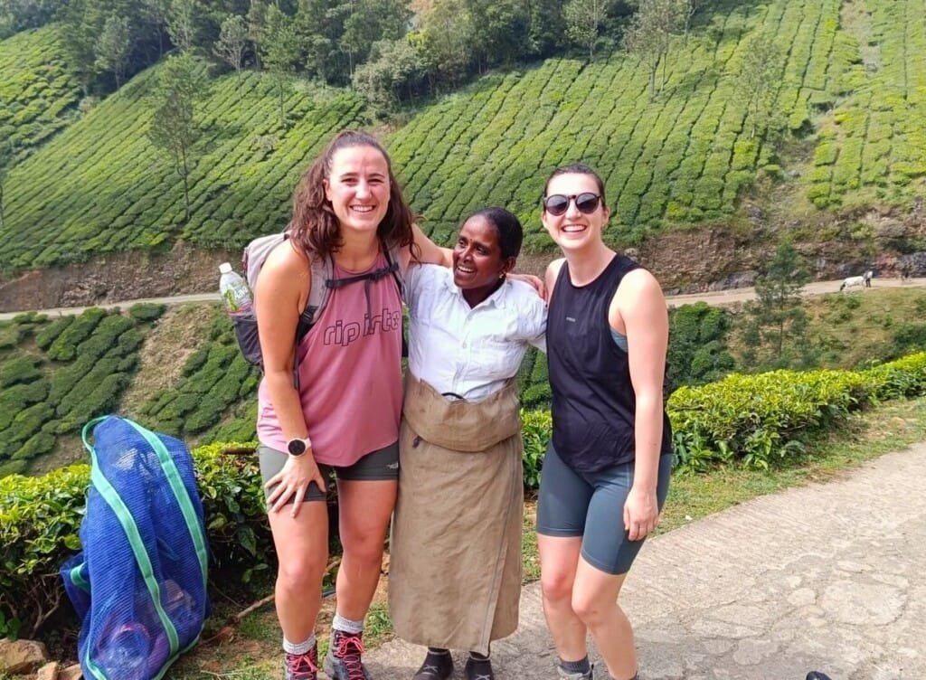 Picture of our guest with tea picker in Plantation in Munnar, Trekking Trails