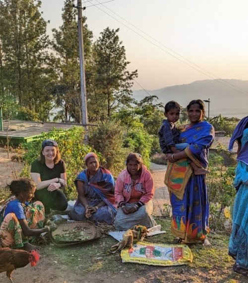 Tibal women in vibrant saris stand together in a scenic tribal village setting in Munnar. Tibal women in vibrant saris stand together in a scenic tribal village setting in Munnar.